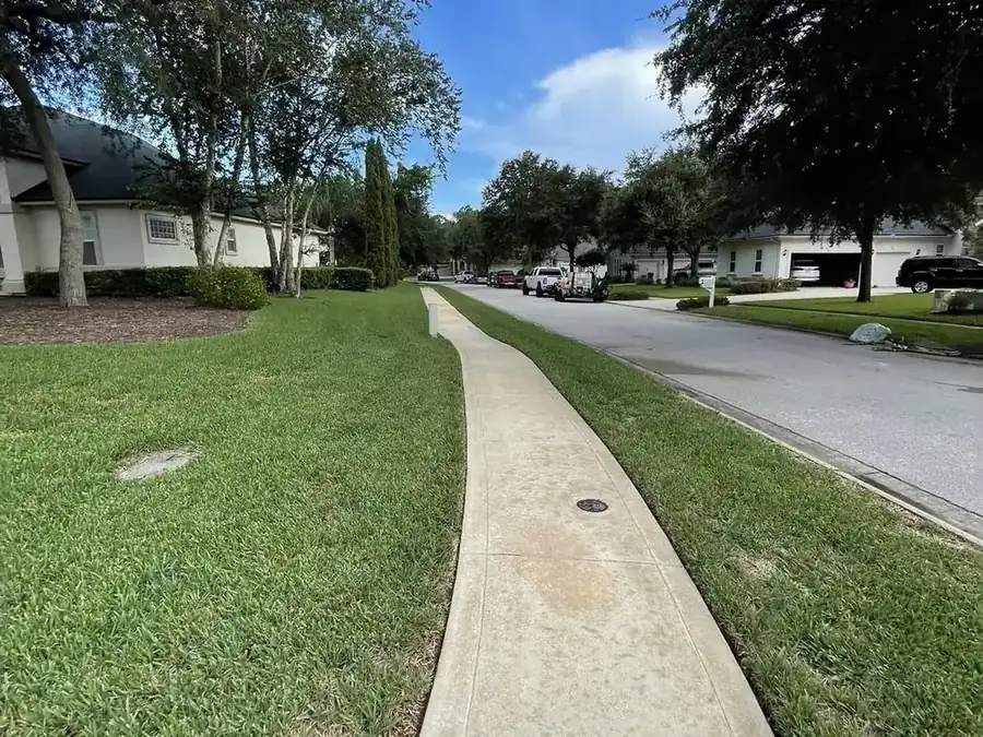 Cleaned residential sidewalk running past homes in a St. Johns County neighbourhood