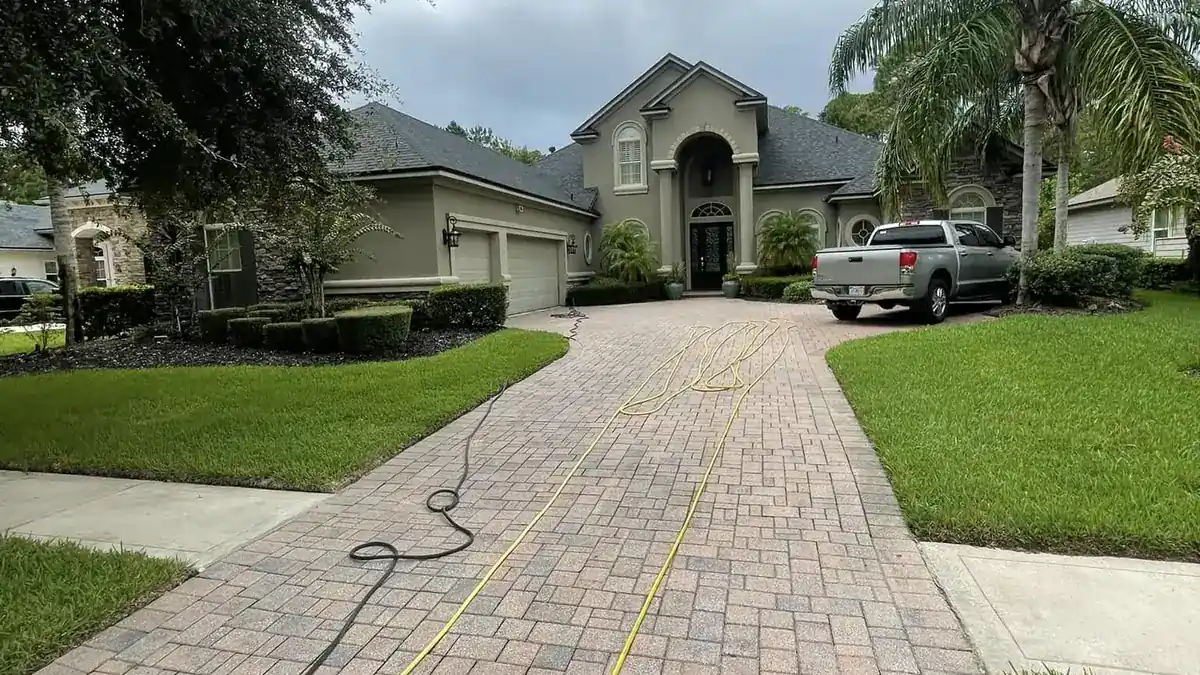 Paver driveway and home exterior cleaned to HOA appearance standards in St. Johns County
